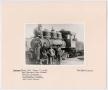 Photograph: [Six Men Posing in Front of a T&P Train]