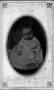 Photograph: [Photograph of a baby girl wearing a light colored dress]