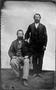 Photograph: [Two older gentlemen with beards, one sitting and one standing]