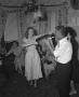 Photograph: [Woman Dancing as Man Plays a Recorder]