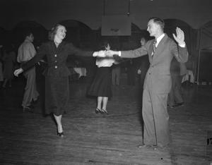 Primary view of object titled '[People Dancing in a Gymnasium]'.