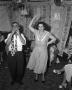 Photograph: [Woman Dancing to a Man Playing Music]