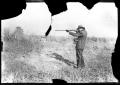 Photograph: [Thomas H. Taylor Shooting a Rifle]