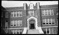 Photograph: [Photograph of the Entrance of Large Brick Building]