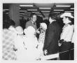 Photograph: [Photograph of Governor Briscoe Meeting Costumed People]