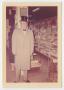 Photograph: [Photograph of Mr. Turney Wearing Top-Hat in Store]
