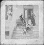 Photograph: [Three women, four children, and a dog on a porch]