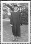Primary view of [Virginia Lee (Nichols) Feeny wearing a cap and gown]