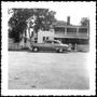 Photograph: [The George Ranch house with an automobile parked in the driveway]