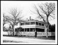 Photograph: [George Ranch house with Mamie George standing in front]