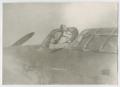 Photograph: [Man in the Cockpit of an Airplane]