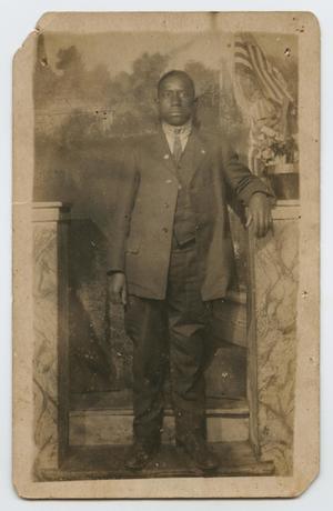 Primary view of object titled '[Postcard Picture of an African-American Man with a US Flag]'.