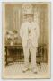 Primary view of [Postcard of a Young African-American Man With His Hands Behind His Back]