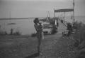 Photograph: [Brown with Baby at Dock]
