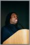 Photograph: [Curtis King speaking behind podium]