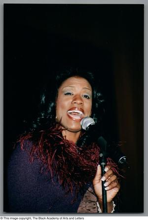 Primary view of object titled '[Tanya Blount singing into mic]'.
