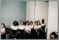 Photograph: [young choir members sitting backstage]