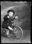 Photograph: Portrait of Baby Boy with Tricycle]