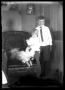 Photograph: [Portrait of Girl and Boy with Dog]