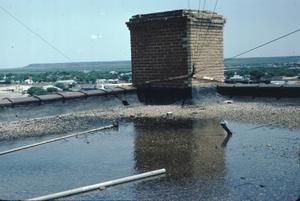 Primary view of object titled '[Municipal Auditorium, (roof of stage flyloft furnace chimney looking SE)]'.