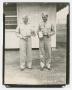 Photograph: [Photograph of Two Officers Holding Trophies]