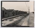 Photograph: [Photograph of a Row of Barracks at Camp Hulen]