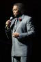 Photograph: [Curtis King speaking on stage]