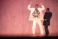 Photograph: [Groom and pastor dancers on stage]