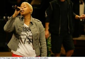 Primary view of object titled '[Chrisette Michele singing on stage]'.