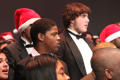 Photograph: [Choir members performing in Santa hats, 2]
