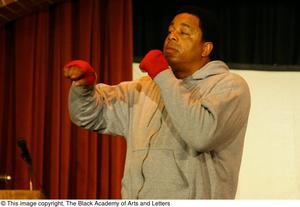 Primary view of object titled '[Vincent Cook in Boxing Stance on Stage]'.