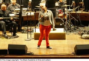 Primary view of object titled '[Chrisette Michele standing on stage]'.