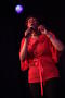 Photograph: [Singer dressed in red]