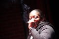 Photograph: [Performer smoking a cigarette]