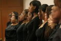 Photograph: [Members of the choir singing while standing]
