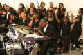 Primary view of [Drummer and choir performing]