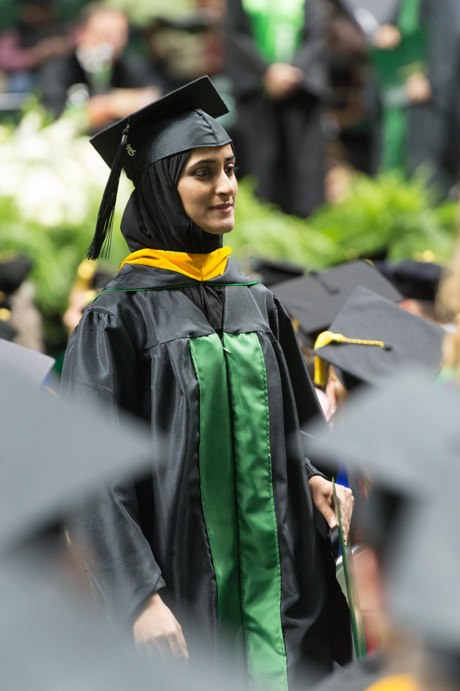 [Graduate Student Walking with her Diploma]
                                                
                                                    [Sequence #]: 1 of 1
                                                