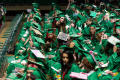 Photograph: [Graduating Mayborn students seated in front of the stage]
