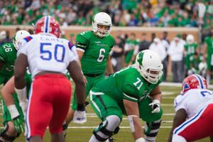 Primary view of object titled '[Mean Green Offense readies for play]'.