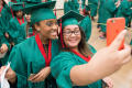 Thumbnail image of item number 1 in: '[Two Students Taking Selfie At Graduation Ceremony]'.