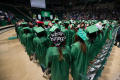 Thumbnail image of item number 1 in: '[Undergraduate Students at Commencement Ceremony with Decorated Caps]'.