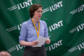 Primary view of [Sarah Lippincott in front of UNT Banner]