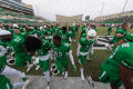 Thumbnail image of item number 1 in: '[Mean Green Football Players on field]'.