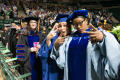 Thumbnail image of item number 1 in: '[Students Giving Peace Signs at Commencement Ceremony]'.