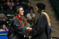 Photograph: [Mayborn graduate shakes the hand of Dorothy Bland]