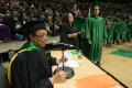 Photograph: [Faculty Member Annoucing Names at Bachelor Commencement Ceremony]