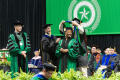 Photograph: [Ph.D Candidate Being Presented with Doctoral Hood]