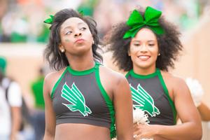 Primary view of object titled '[Two North Texas Dancers at Homecoming Game]'.