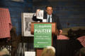 Primary view of [Neil Foote holding up Mayborn magazine while speaking at Soiree]