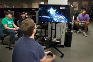 Primary view of object titled '[Students playing video games during Game Day event]'.